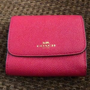 Small pink Coach wallet